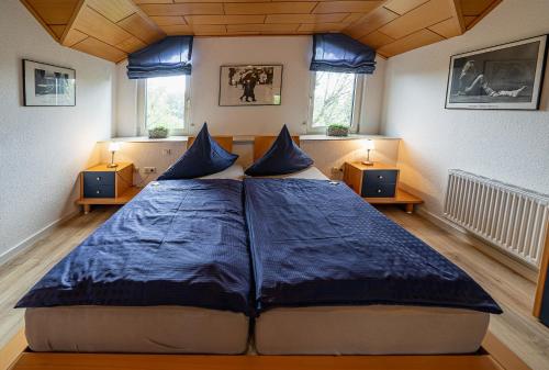 Postel nebo postele na pokoji v ubytování Ferienwohnung Apartment am Hotel Kloppendiek