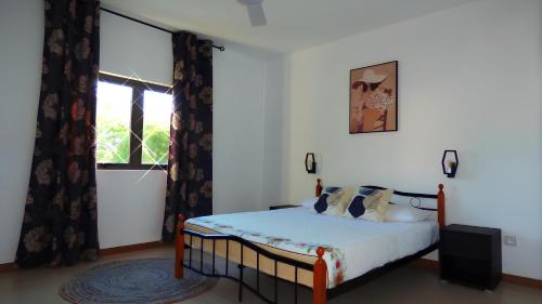 Ένα ή περισσότερα κρεβάτια σε δωμάτιο στο La Nuit Étoilée