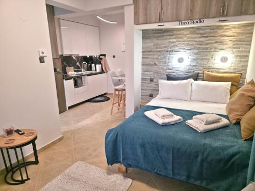 a bedroom with a bed with two towels on it at Riana Dlx Studio in Kastoria