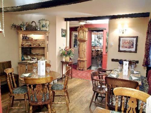 a dining room with a table and some chairs at The Chequers Inn in Grindleford Bridge