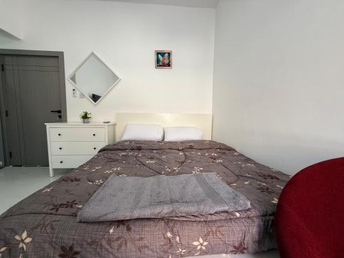 Ένα ή περισσότερα κρεβάτια σε δωμάτιο στο Al-Manaseer Studio