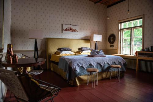 Giường trong phòng chung tại Landgoedboerderij Oosterheerdt