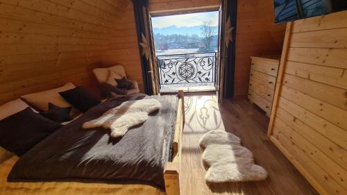 Postel nebo postele na pokoji v ubytování Domki góralskie Sabałecka II