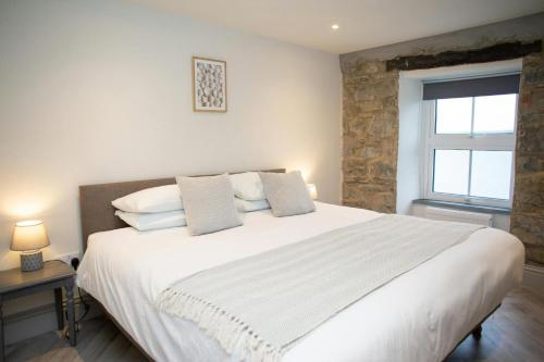 Postel nebo postele na pokoji v ubytování Bay View New Quay