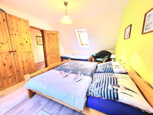 a bedroom with a bed in a room at Strandresidenz Wittower Heide in Glowe
