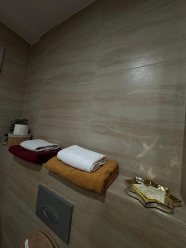 a bathroom with two beds on the floor at Lucas investment L3 -104 in Creţuleasca