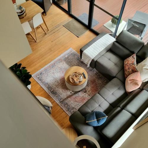 an overhead view of a living room with a couch at Seaside Villa Oasis - Pool & Wi-Fi in Preston Beach