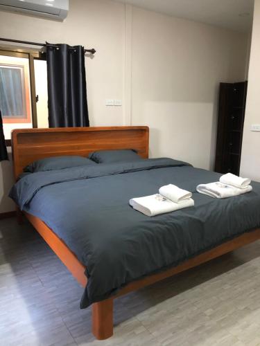 En eller flere senge i et værelse på The Sun homestay