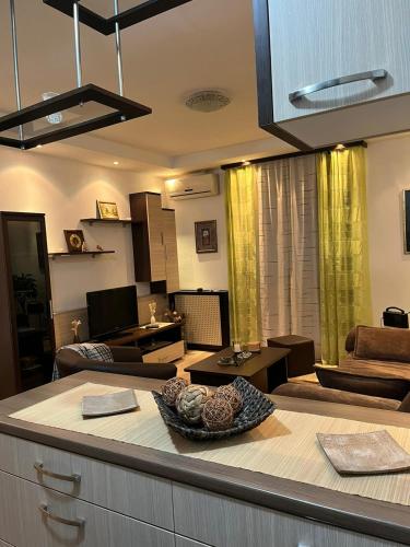a kitchen and living room with a table and chairs at EukaVita in Banja Koviljača