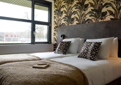 Llit o llits en una habitació de Hotel Wander
