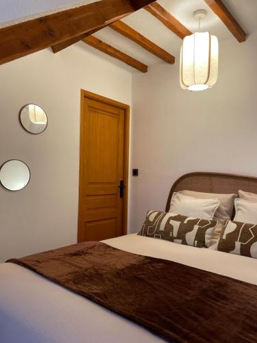 Ένα ή περισσότερα κρεβάτια σε δωμάτιο στο L'évidence