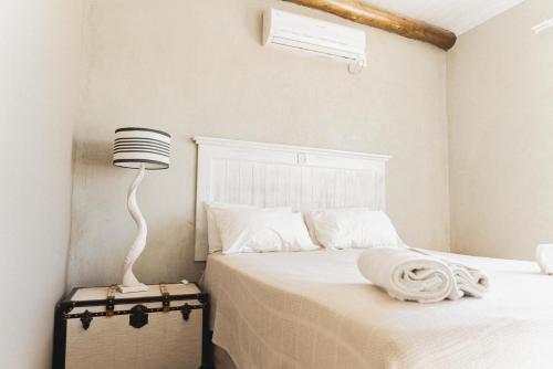 Ένα ή περισσότερα κρεβάτια σε δωμάτιο στο Kalahari Cottage