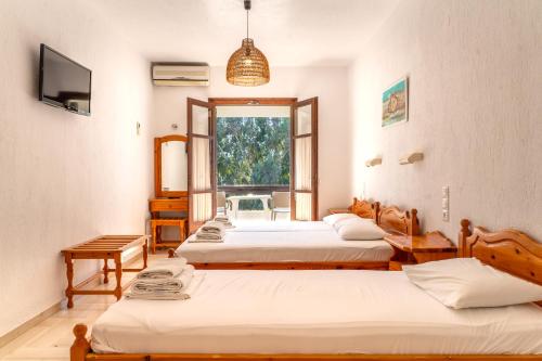 Postel nebo postele na pokoji v ubytování Villa Spartias