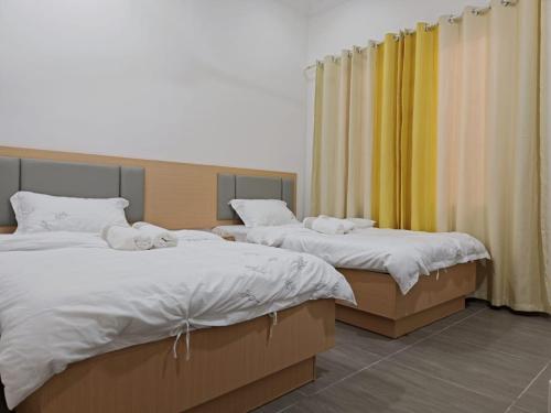 Ένα ή περισσότερα κρεβάτια σε δωμάτιο στο Bungalow House Sentul