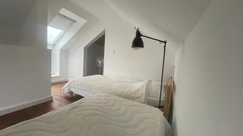 Postel nebo postele na pokoji v ubytování Maro Appartments