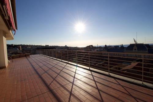 a view of the sun from the roof of a building at Residence Le Terrazze in Trieste