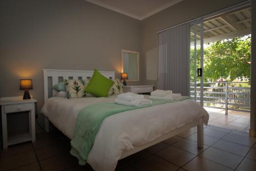 Ένα ή περισσότερα κρεβάτια σε δωμάτιο στο Aloe Ridge