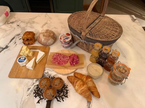 a table with different types of bread and other foods at The Silvan Lodge, Peace, Privacy, and Pure calm 