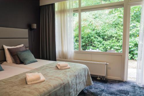 Postel nebo postele na pokoji v ubytování Hotel & Restaurant Wildthout