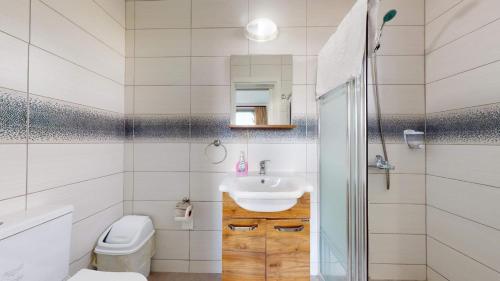 a bathroom with a sink and a toilet at Villa Cypress Villas in Kyrenia