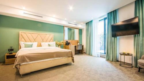 Ένα ή περισσότερα κρεβάτια σε δωμάτιο στο Central Carol APARTHOTEL 2