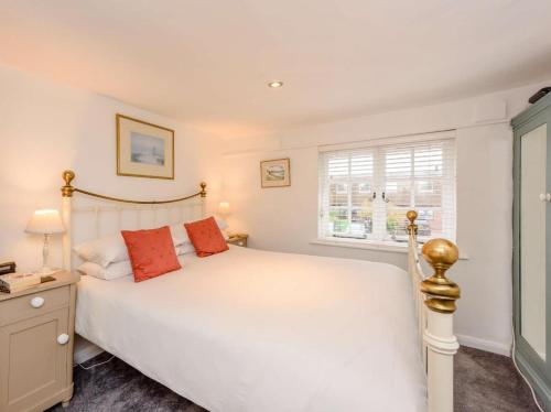 a bedroom with a white bed and a window at 1 Bed in Tenterden oc-66342 in Tenterden