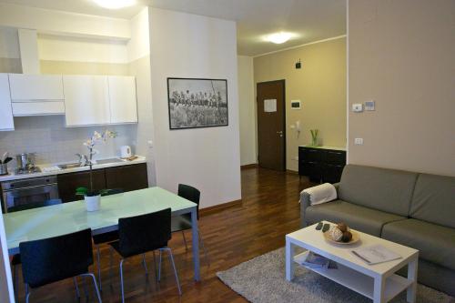 a living room with a couch and a table at Residence Le Terrazze in Trieste