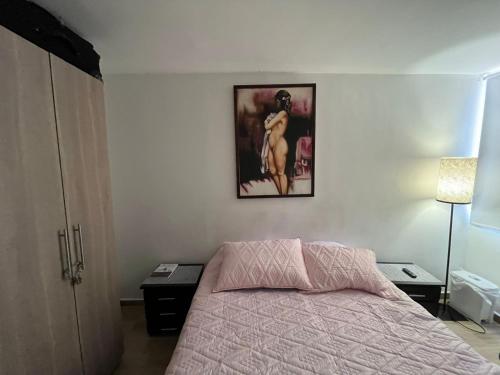 Postel nebo postele na pokoji v ubytování Habitación confortable cama doble Ibagué