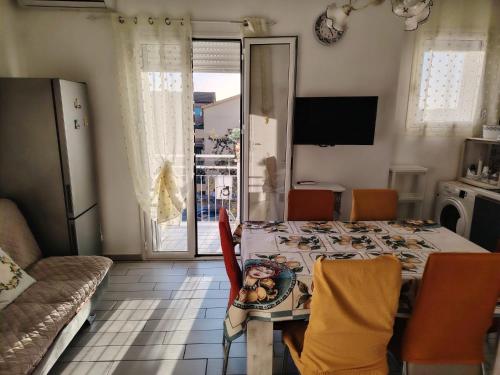 a dining room with a table with a plate of food on it at La casa di San Pio X in Agrigento