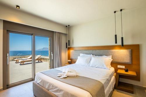 Ένα ή περισσότερα κρεβάτια σε δωμάτιο στο Anemelia Villas