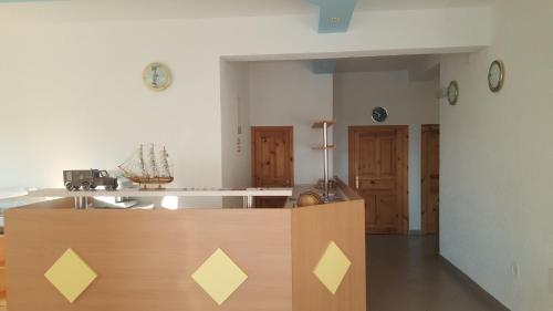 a kitchen with a wooden counter top in a room at Guesthouse Bosankic in Makarska