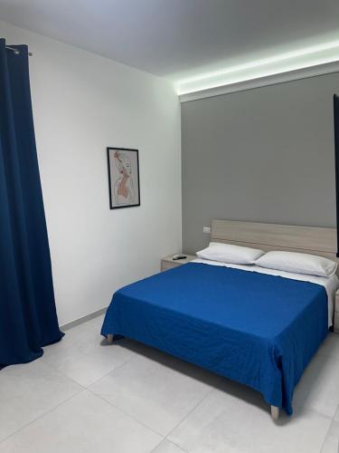 Ένα ή περισσότερα κρεβάτια σε δωμάτιο στο Levante Casa Vacanze