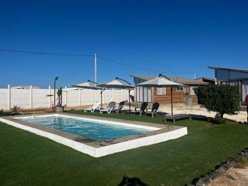 Πισίνα στο ή κοντά στο Cabaña en Tongoy