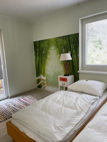 a bedroom with a large bed and a window at Ferienwohnung Kaltenegger in Gaal