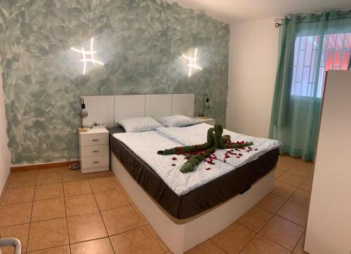a bedroom with a bed with christmas decorations on it at Vista de Torre in Costa Del Silencio