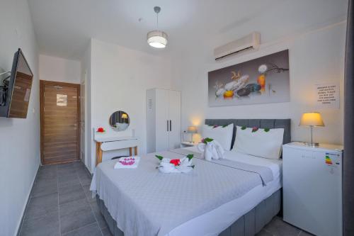 Кровать или кровати в номере YENI DOGA HOTEL