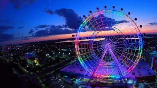 a ferris wheel at a carnival at night at Vista Cay Jewel Luxury By Universal Orlando Rental in Orlando