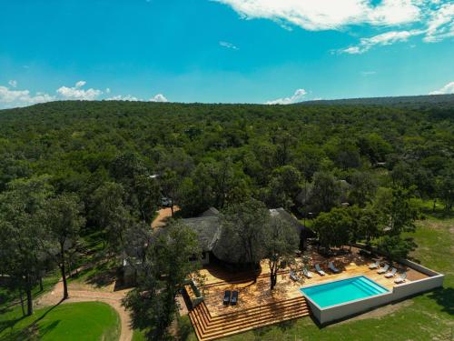 an aerial view of a house with a swimming pool at Ilanga Lodge Welgevonden Game Reserve in Welgevonden Game Reserve