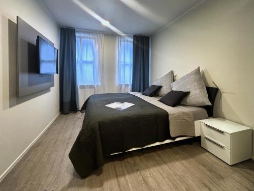 Postel nebo postele na pokoji v ubytování HAVENU Hotel Quartier 8