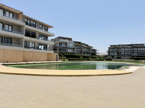 المسبح في Apartamento Vista Reserva y Playa en Paracas أو بالجوار