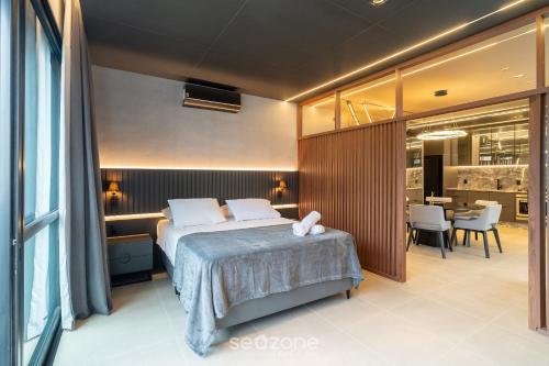 Postel nebo postele na pokoji v ubytování TVT - Estúdios de luxo no centro de Florianópolis