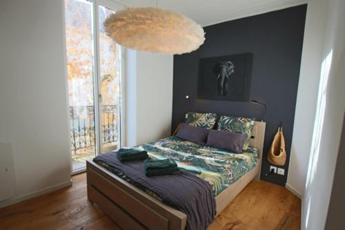 En eller flere senge i et værelse på Appartement 43m2 1 chambre en hyper centre