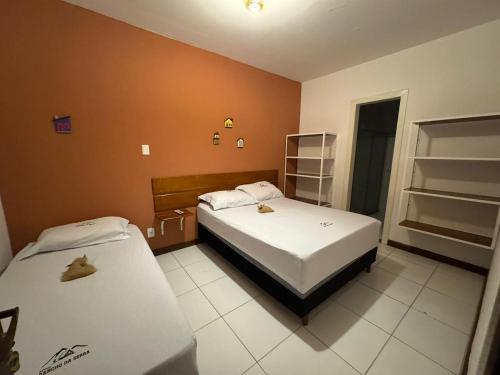 Ένα ή περισσότερα κρεβάτια σε δωμάτιο στο Sitio Rancho da Serra