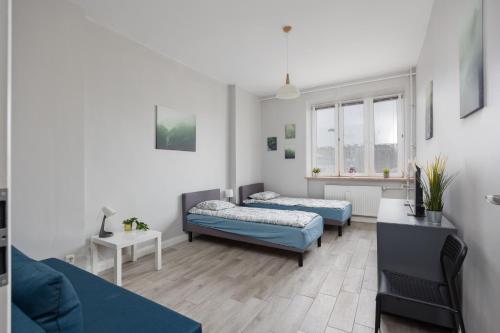 Кровать или кровати в номере Pokoje Metro Pole Mokotowskie