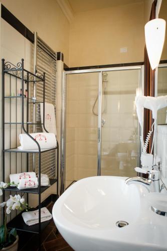 a bathroom with a sink and a shower at Villa Pallotta Luxury B&B in Cerignola