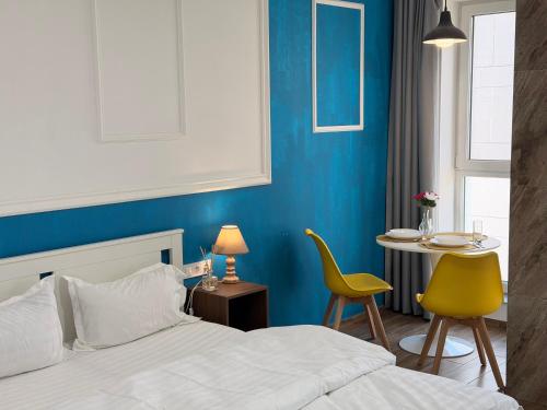 En eller flere senge i et værelse på S Stay Apartments