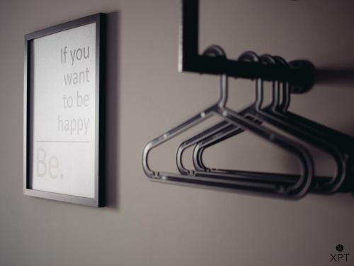 a picture of a sign hanging on a wall at XPT Águeda - Alojamento Local in Águeda