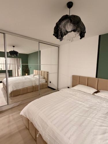 En eller flere senge i et værelse på Sage Studio