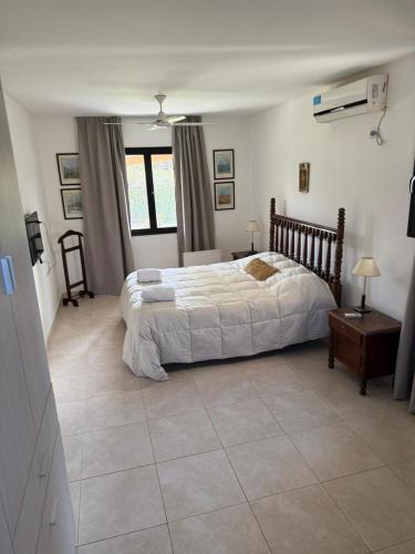 a bedroom with a large bed in a room at Barrio Privado - YB - Tucumán in Yerba Buena