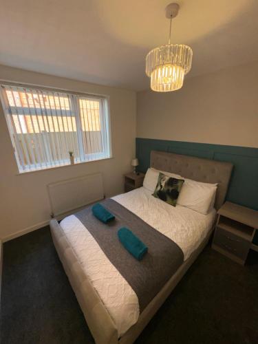 a bedroom with a bed with two pillows on it at Coastal Retreat - Skegness in Skegness